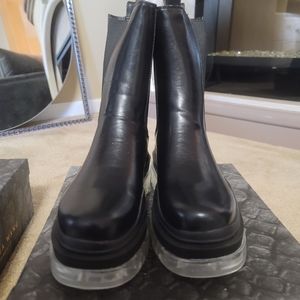 Black and clear sole platform boots.